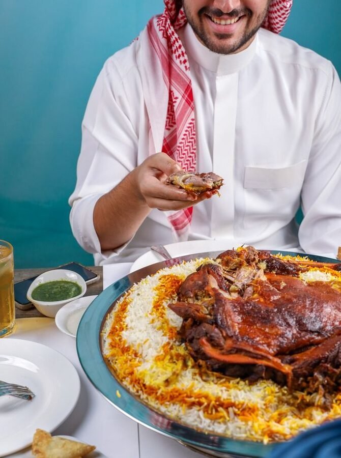 Traditional Saudi Arabian whole lamb Mandi feast served on saffron rice, authentic Arabic food at Zafran Mashawi Ilford London